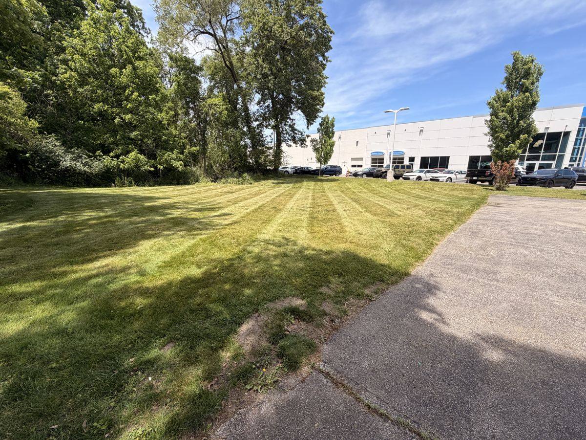 Thick green striped lawn after Covenant lawn care service