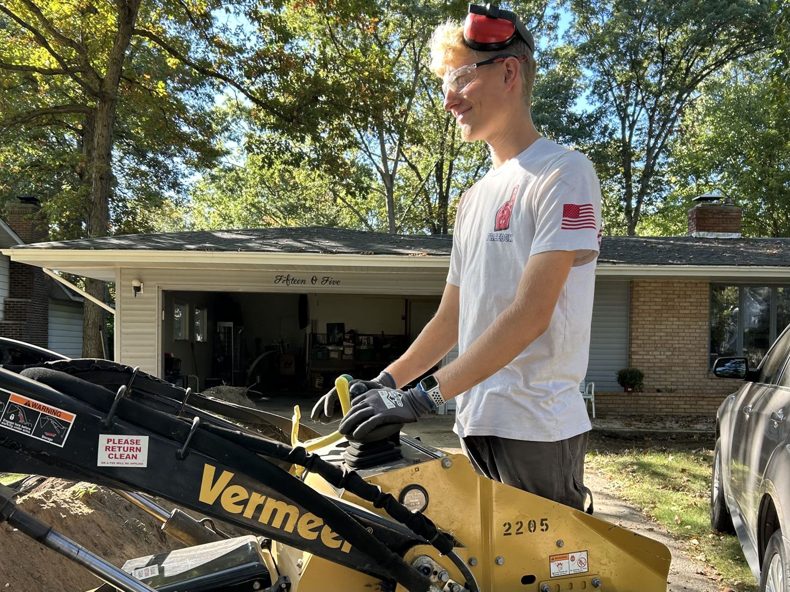 Caleb Overmyer operating a Vermeer mini skid steer on a landscape job in Elkhart, Indiana